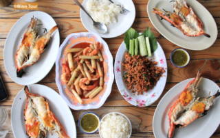 dining table with lots of Thai dishes